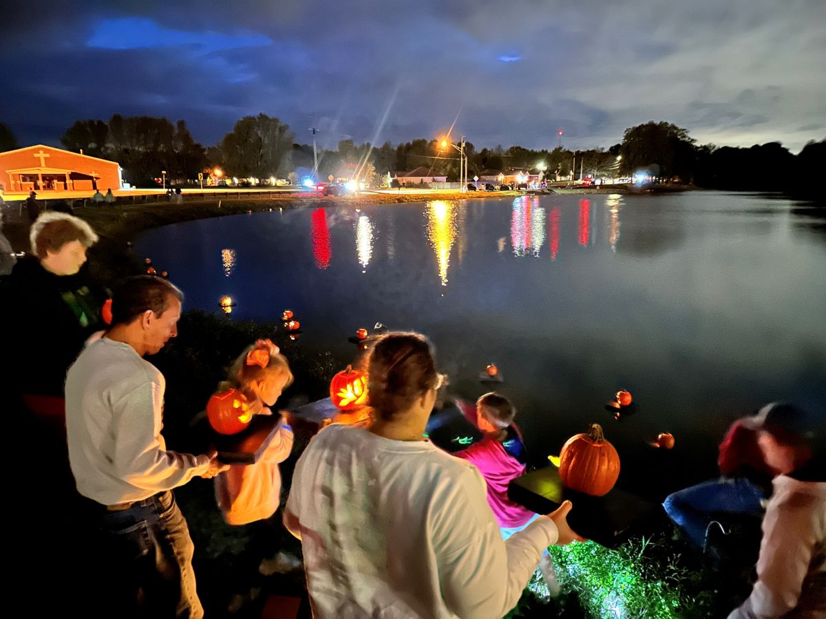 Releasing pumpkins into Busby Lake